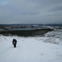 Snowy road up to the base of the hill
