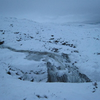 Frozen stream coming off Chno Dearg
