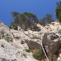 Jeanie belaying at top of 3rd pitch of Espolon Central Directa