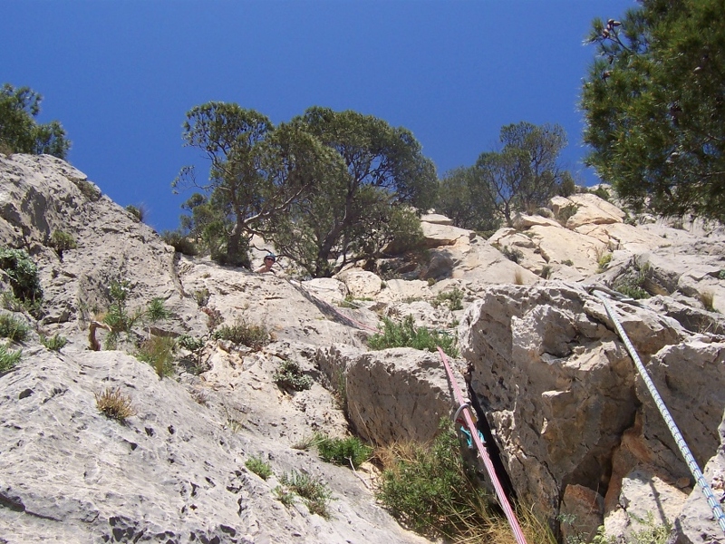 Jeanie belaying at top of 3rd pitch of Espolon Central Directa.JPG