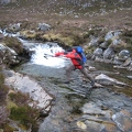 Colin leaping the stream to get back across to the access path