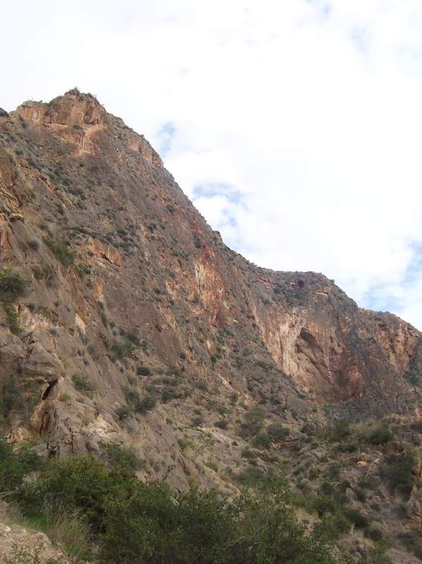 Orihuela - Looking towards Cueva Ahumada with climbers visible high up on La Cantera.JPG