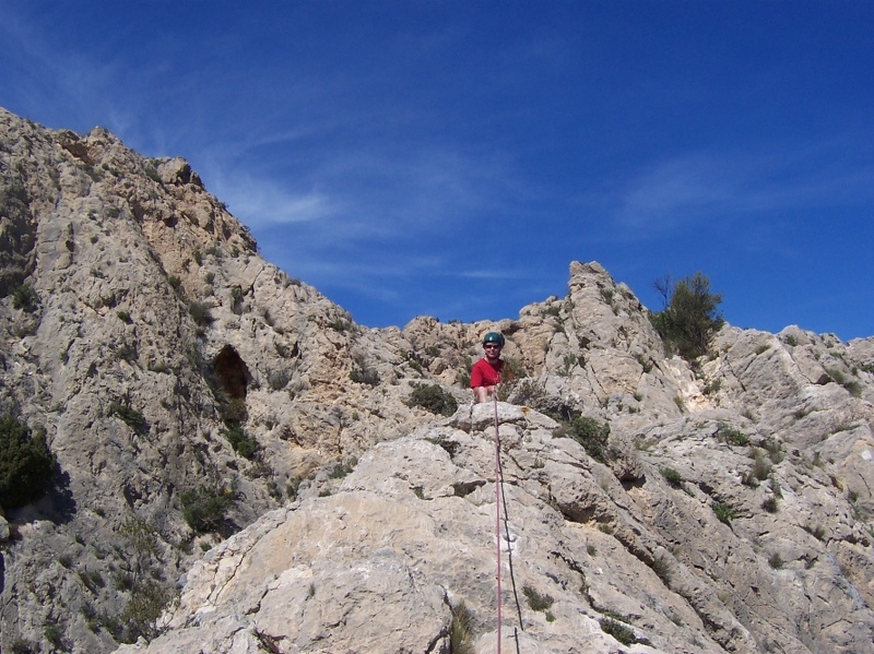 Stuart belaying at the top of the main face of Marin.JPG
