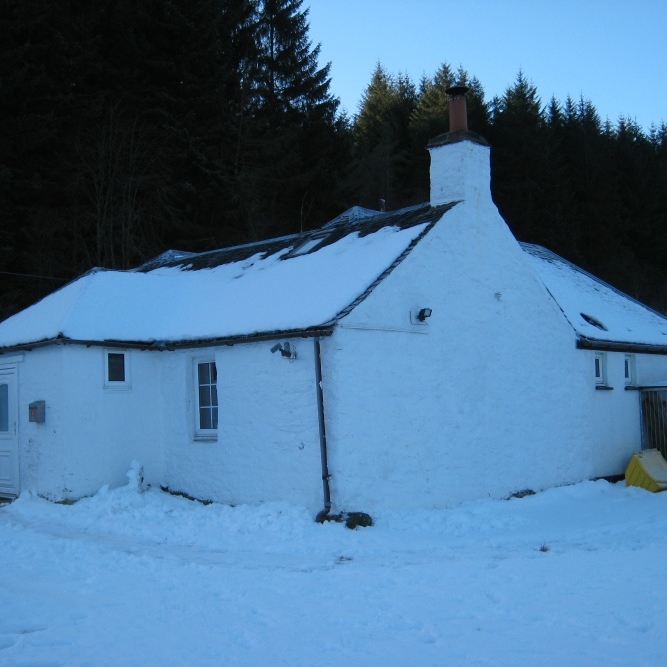 Cottage wearing its winter coat