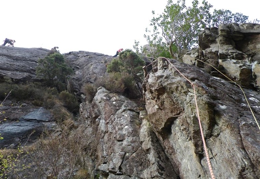 Fidelity - Stuart on the upper slab, other climbers on Damnation