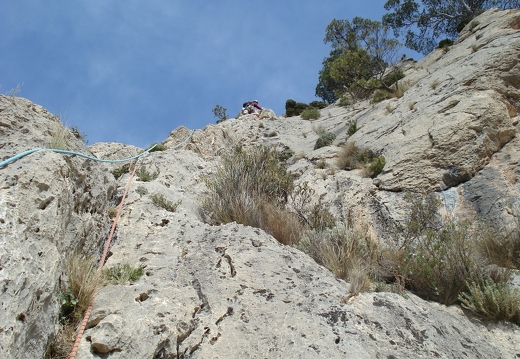 Jeanie climbing the arete on the 6th pitch of Via Gene.