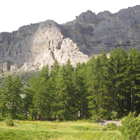 A view up to the crags at Chemin du Roy - Routes in the sunlight