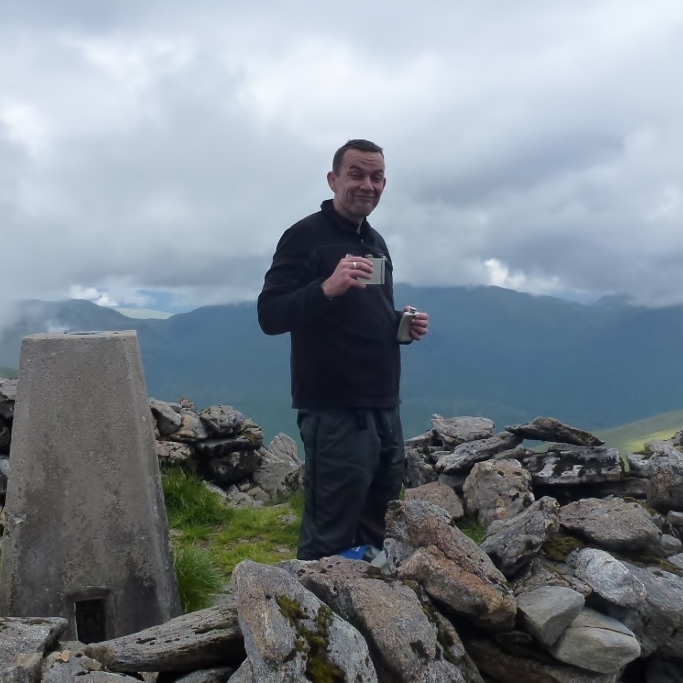 Dave celebrating his 100th Munro summit (Carn Eighe)