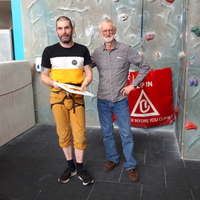 Keith receiving his award from Colin