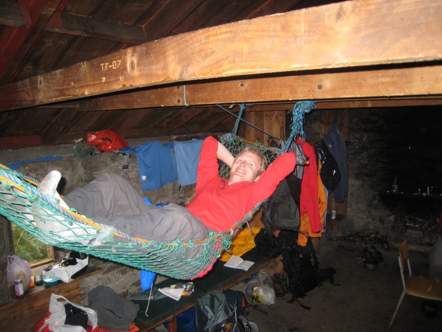 Robin trying out the hammock in the bothy