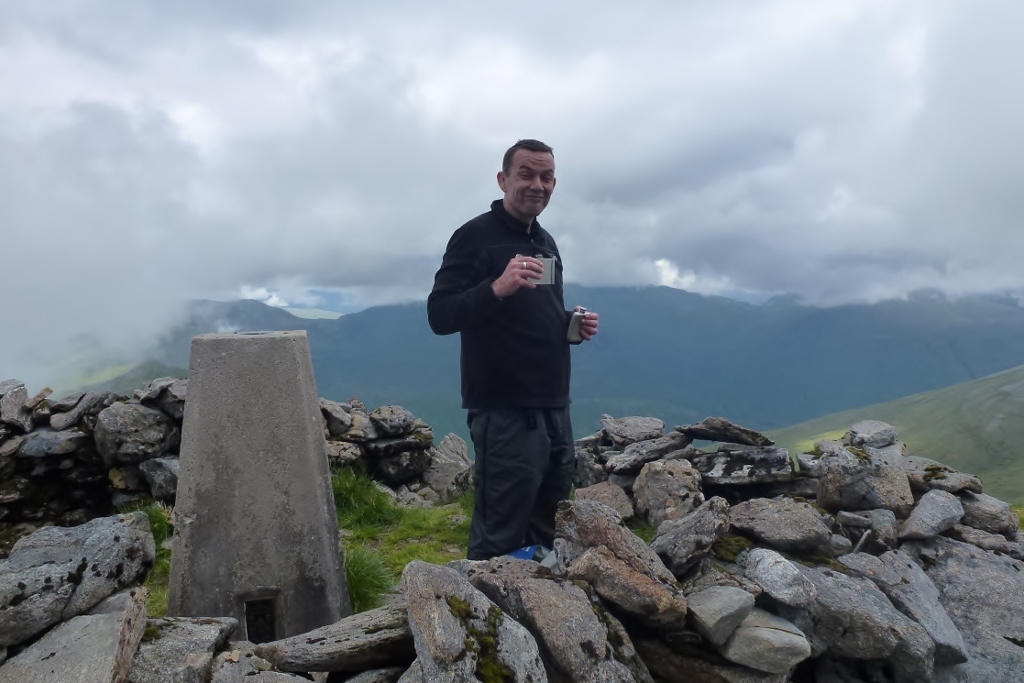 Dave celebrating his 100th Munro summit (Carn Eighe)